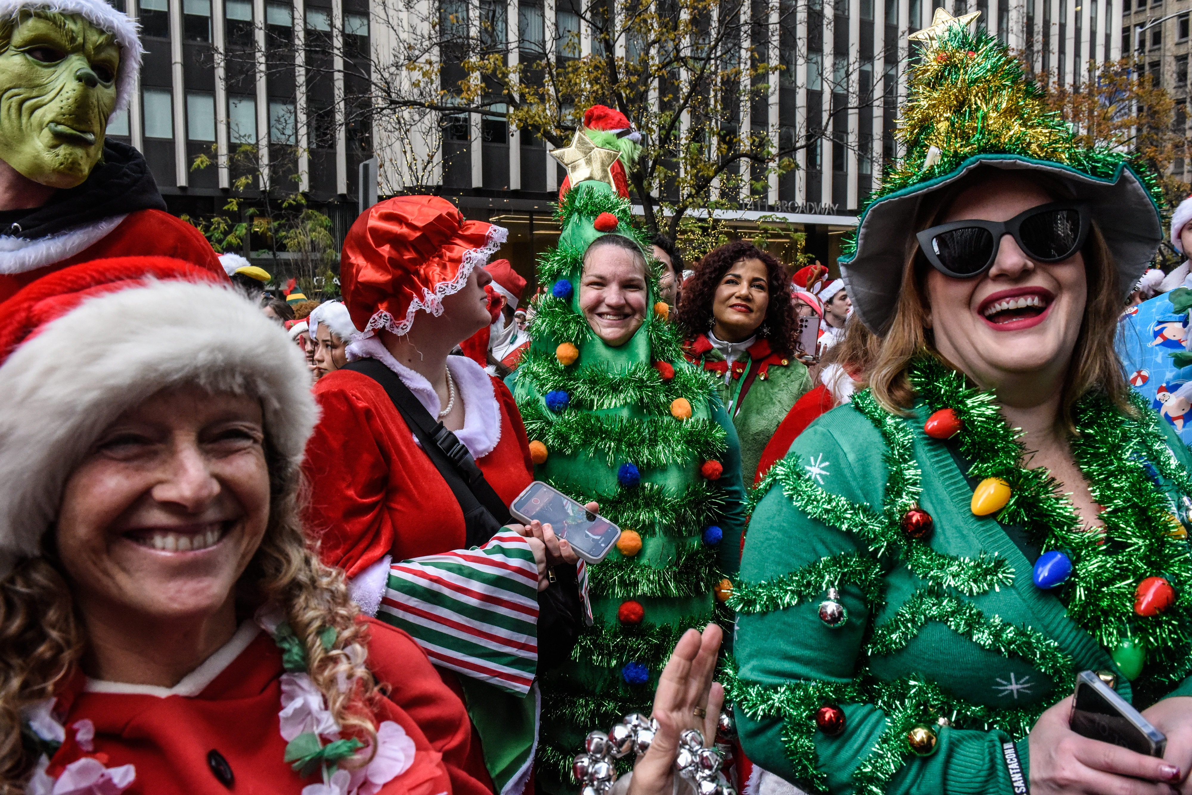 Revelers dressed as holiday characters participate in the annual SantaCon pub crawl in December 2023 in New York City.